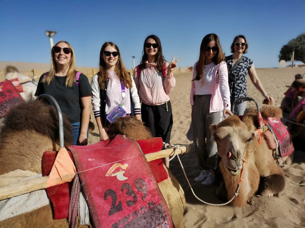  camel ride through the Singing Sand Dunes in Dunhuang