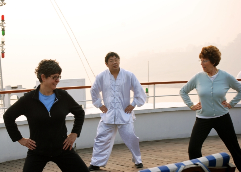 Practice Tai Chi on the deck of the cruise ship in the morning