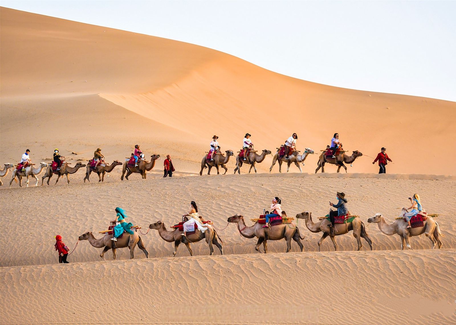 Riding Camel in Dunhuang Echoing-Sand Mountain