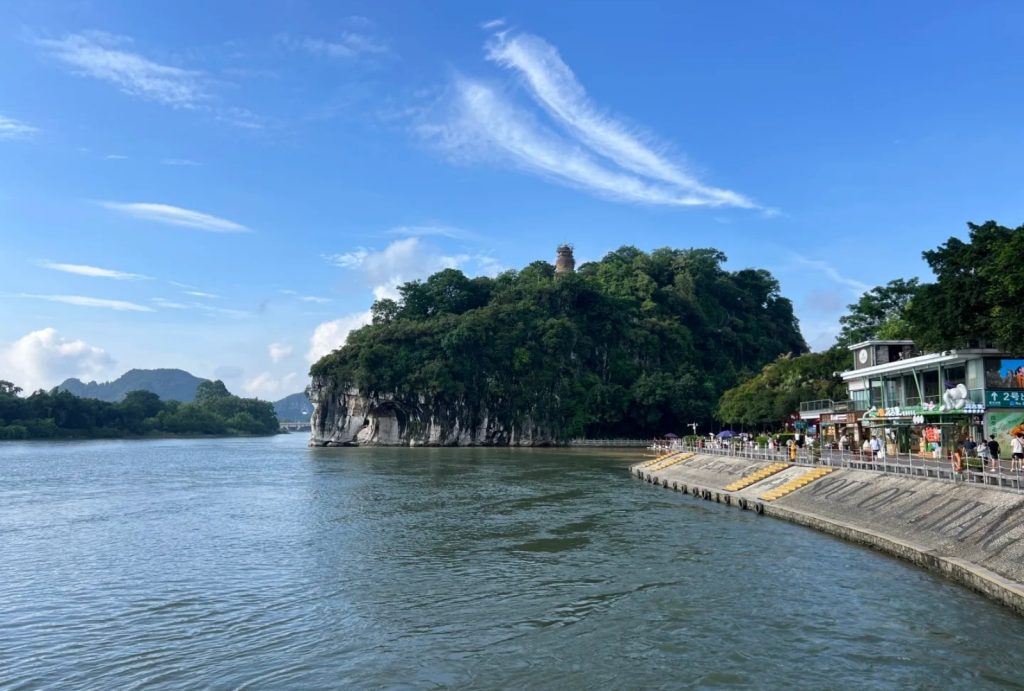 A riverside view of the whole hill