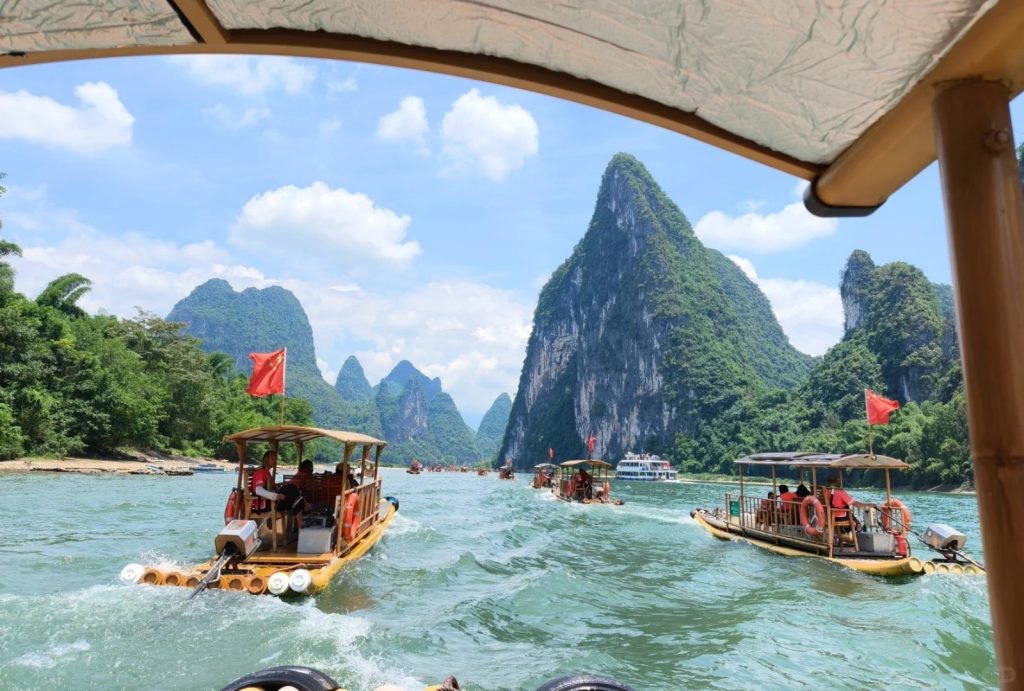 Enjoy a closer view of the Li River by bamboo raft.