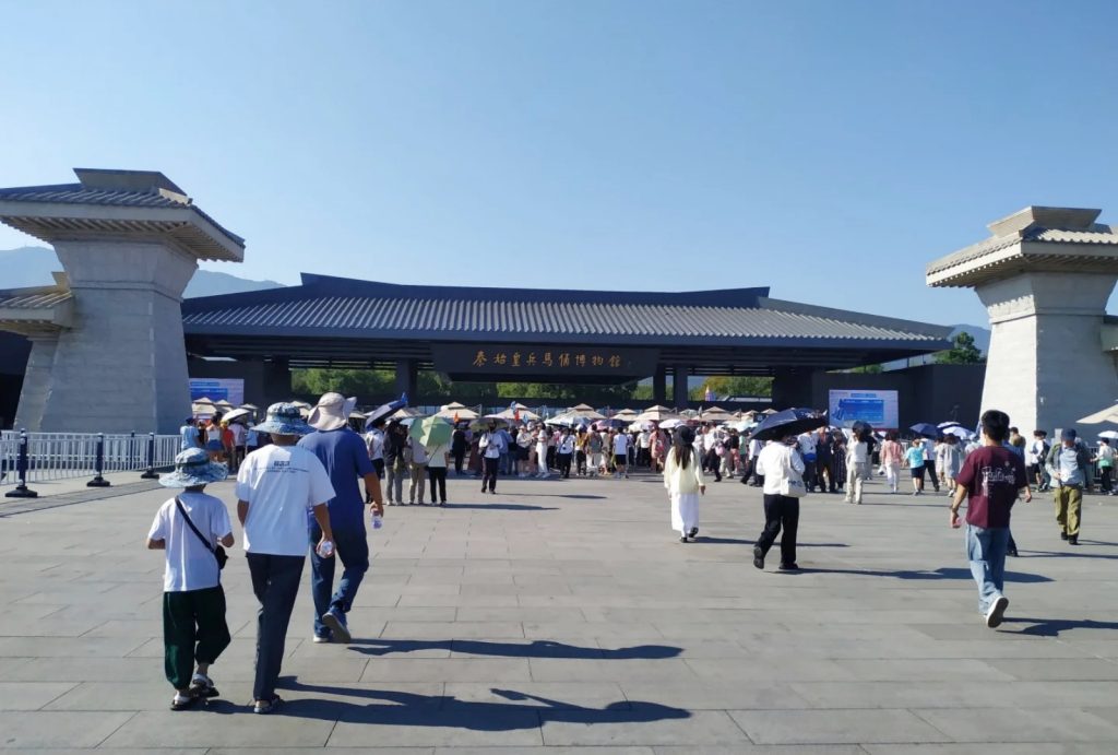 Go through the ticket check and security at the entrance
