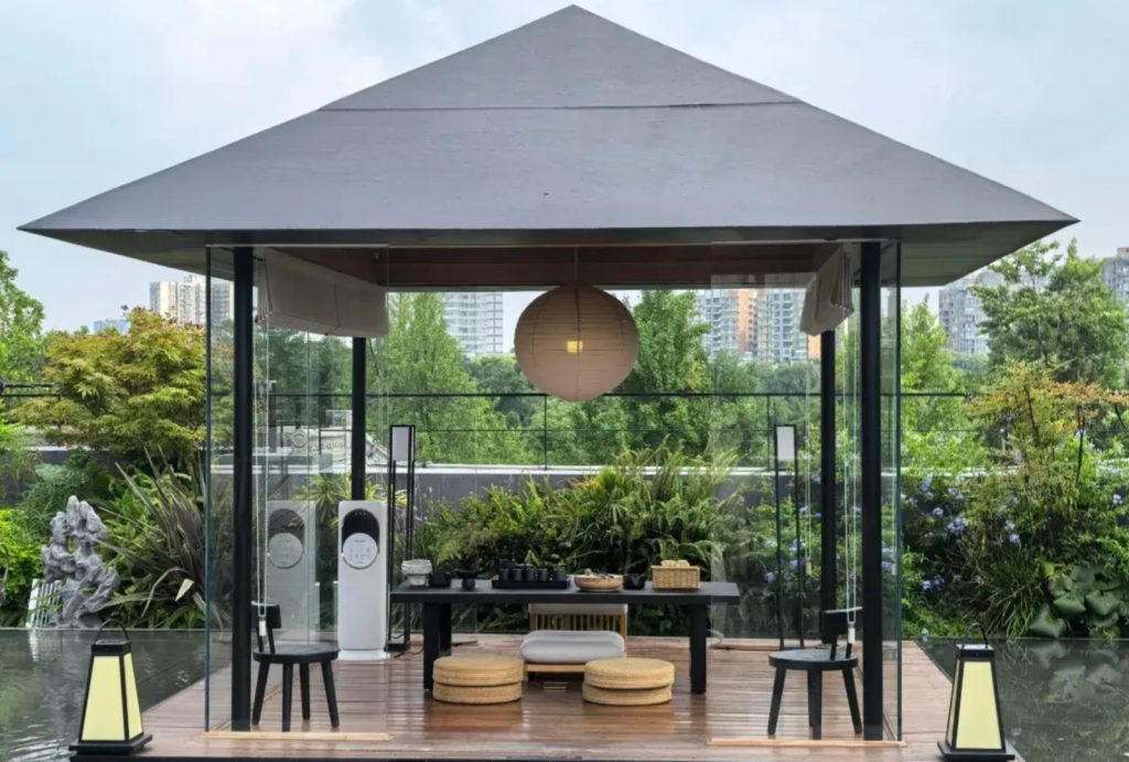 Rooftop courtyard at Terra Art Zen Hotel with greenery and a peaceful city view.